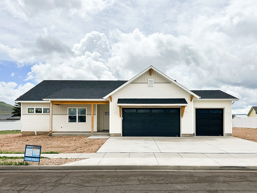 Photo of a charming, one-level farmhouse home with the words 